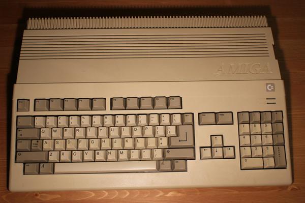A beige integrated keyboard old looking computer