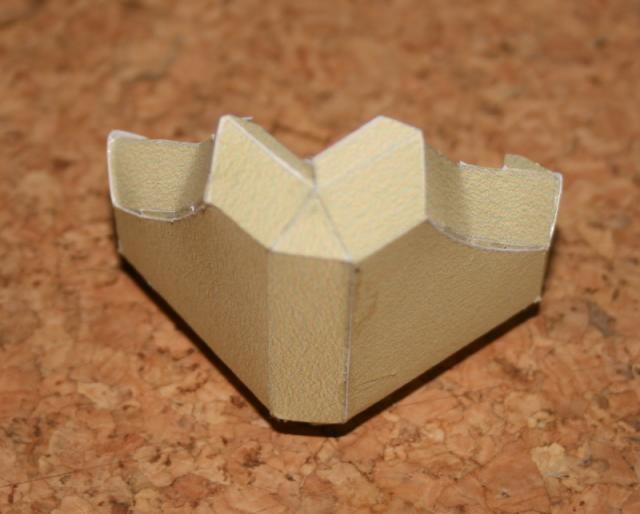 Weighted companion cube model, corner with concave surfaces fitted.